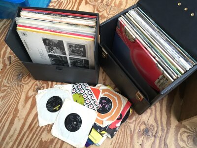 Two record cases of LPs, EPs and 7" singles by various artists including Elton John, Eric Clapton and others.
