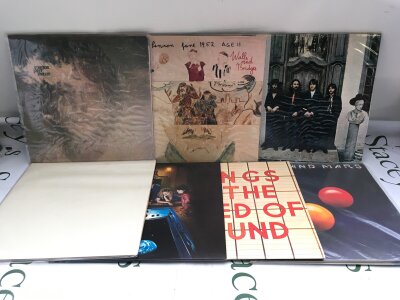 Seven Beatles and related LPs comprising the White Album, Venus And Mars, Walls And Bridges and others.