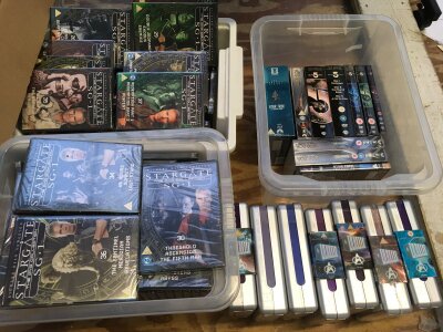 Four boxes of sci fi DVDs and BluRays.