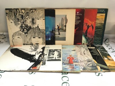 Twelve LPs by various artists including The Beatles, Led Zeppelin, Pink Floyd and others.