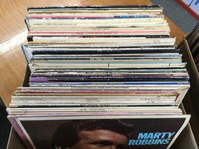 Four boxes of country music LPs by various artists including Hank Williams, Buck Owens, Conway Twitty and many more.