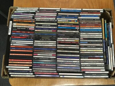 Two boxes of CDs by various artists including Little Richard, Bruce Springsteen, Gene Vincent and others.