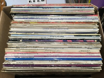 Four boxes of LPs by various artists including Elvis Presley, Linda Ronstadt, Carl Perkins and others.