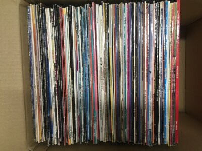 A box of LPs, 12" and 7" single by various artists including David Bowie, Quincy Jones, George Benson and others.