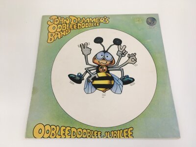 A first UK pressing of the John Dummer's Oobleedooblee Band Oobleedooblee Jubilee LP. An original 1973 release with Vertigo swirl inner sleeve 6360 083. Vinyl EX.