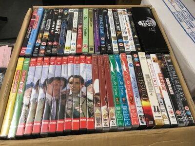 Four large boxes of BluRays, DVDs, various TV series and feature films.