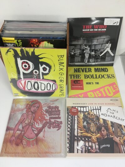 A record case of 24 sealed LPs by various artists including Sex Pistols, The Who, Morrissey and others.