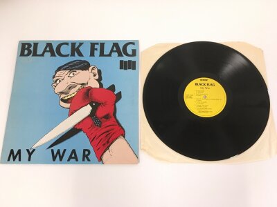 A rare Black Flag UK mispress of the My War LP, 1984 SST 023. Etched runouts SST-023-A LYN-14109-IY .Z. and SST-023-B LYN-14110-IY .Z. The running order for The Swinging Man and Forever Time are switched on the back cover but correct on the label.