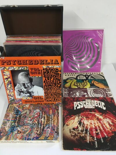 A record case of 1960s/70s psychedelic rock and garage rock LPs by various artists . Also includes the book Fuzz, Acid And Flowers by Vernon Joynson.