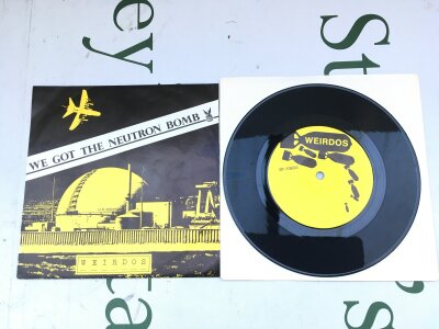 A first US pressing of the 7" single We Got The Neutron Bomb by Weirdos, one of only 5000 pressed. Only 2500 were sold, the rest were destroyed in a flood.
