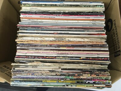 A box of LPs by various artists including Led Zeppelin, The Rolling Stones, The Who and others.