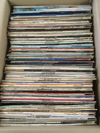 Three boxes of LPs and 12" singles by various artists including The Rolling Stones, Bob Marley, Paul McCartney, Bob Dylan and others.