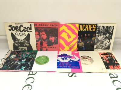 Twenty punk 7" singles by various artists including The Dickies, Joe Cool, The Alley Cats and others.