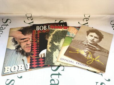 Four Bob Dylan concert programs with tickets plus a 1978 book on Dylan by Barry Miles.