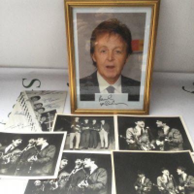 A Paul McCartney autograph housed in a frame with a photo of Paul plus some early 1960s photographs of The Beatles on stage. No COA.