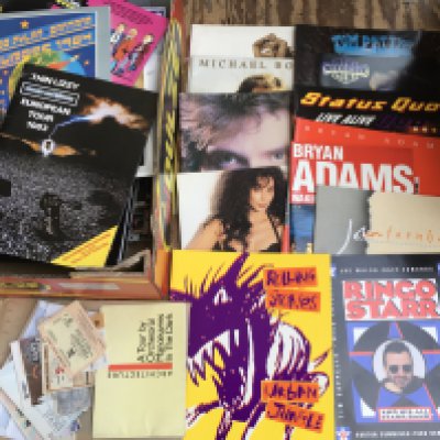 A box of concert programmes, tickets, books and calendars for various artists including The Rolling Stones, Bryan Adams, OMD and others. Most programmes pictured have their loose ticket(s) enclosed within.