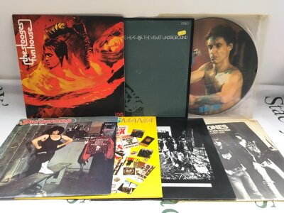 Seven punk rock LPs and 12" singles by various artists including The Stooges, Ramones and others,