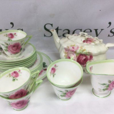 A collection of Royal Doulton teaware in June pattern plus a Doulton teapot. Shipping category D.