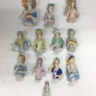 A collection of pin dolls. Shipping category D.