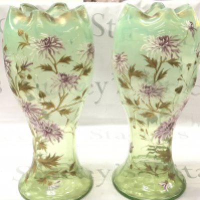 A pair of Victorian cold painted vases decorated with raised gold enamel and hand painted white Chrysanthemums. 38.5cm tall. Some cosmetic flaws but no obvious damage or restoration.This lot cannot be posted