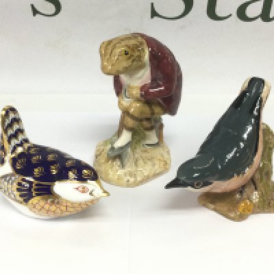 A Crown Derby paperweight in the form of a bird, a Beswick figure of a Nuthatch and a Royal Albert figure of Jeremy Fisher (3). Shipping category D.