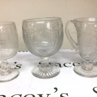 Three cut glass wheel and etched glass goblets of large size engraved with the cypher of Elizabeth II and conforming ornamentation. Hight 22cm no obvious damage. NO RESERVE.