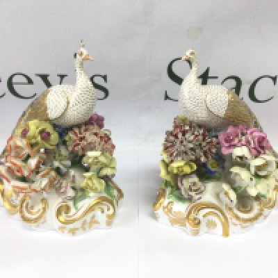 A pair of fine quality Crown Derby figures of peacocks with encrusted floral decoration, a/f. Approx height 16cm. Shipping category D.