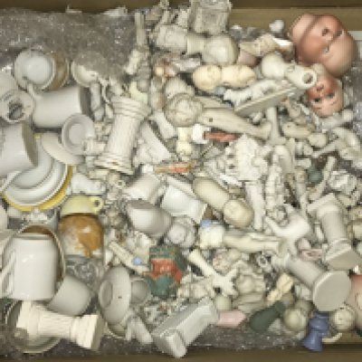 A case containing miniature dolls , Victorian and later. This lot cannot be posted