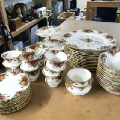 A Royal Albert old country roses tea set including saucers, cups, plates etc . This lot cannot be posted