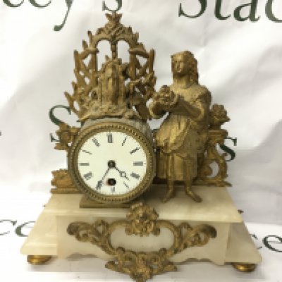 A French Gilt marble clock. This lot cannot be posted