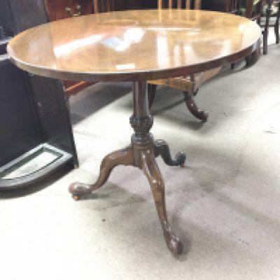 A late George III mahogany table the hinged circular top on an inlaid an turned column and splayed legs. NO RESERVE