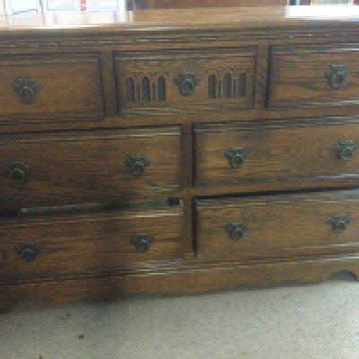 A oak chest fitted with seven drawers.