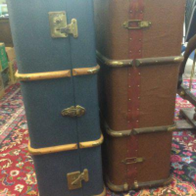 Two brass bound tracking trunks.