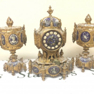 A quality French and enamel late 19th century clock garniture the blue enamel with figures and applied gilt. No pendulum Hight 33cm