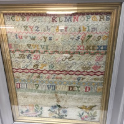 A Victorian needlework sampler in frame.