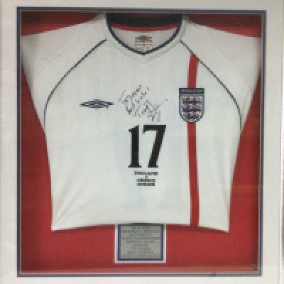 A framed and glazed 2001 England shirt signed by Teddy Sheringham, approx 73cm x 78cm. Shipping category D.