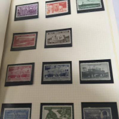 Nine Albums containing world stamps including some 19th century stamps. Turkey Canada Bermuda including unused Four blocks of George VI stamps. Indian states Chamba China Transvall and others.