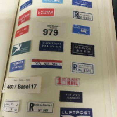 A collection eight of world stamp albums including some 19th century stamps Queensland world Express and Airmail postal labels Chanel Island stamps and others (8)