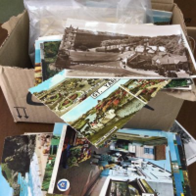 Two boxes containing Victorian postcards, scrap books etc