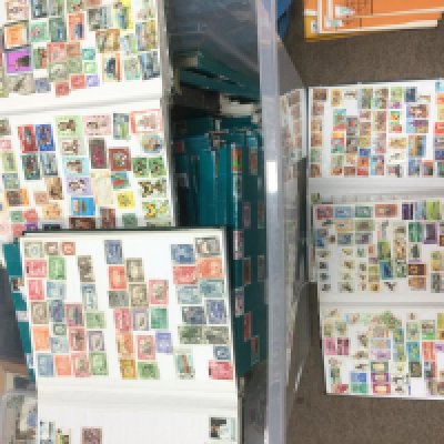 A large collection of world stamps in various binders. Shipping category D.