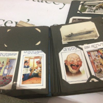 Four albums containing early 20th century British postcards including an interesting collection of early comical cards (4)