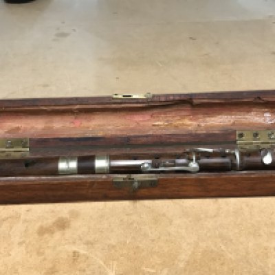 A cased rosewood flute , postage category B