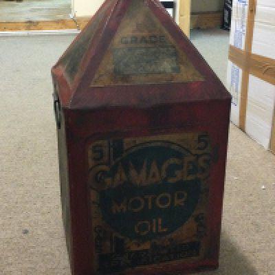 A vintage red pyramid top 5 gallon can advertising Gamages motor oil, 50cm tall . This lot cannot be posted
