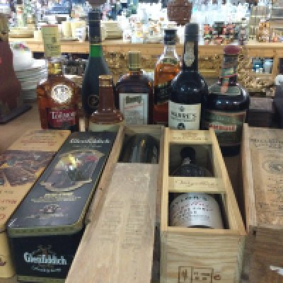 Twelve bottles of alcohol including Whisky and Port