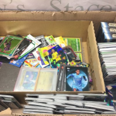 An assortment of trading cards including Pokemon, Topps, Panini , Star Wars , Doctor who etc. postage category C