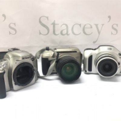 Three vintage cameras, Nikon and Minolta. Postage category B