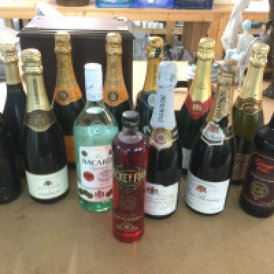 A collection of champagne and spirits. Shipping category D.