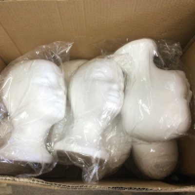 Ten polystyrene mannequin heads. Shipping category C.