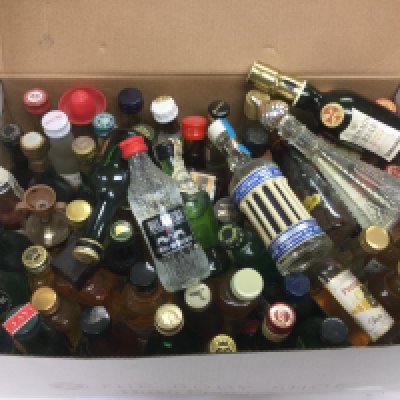 A collection of miniature bottles of alcohol. Shipping category D.