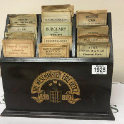 A Vintage The Westminster Fire Office leaflet box display Insurance and Indemnity policys.